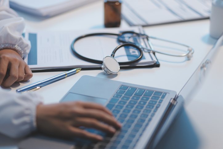 A clinician and patient going over information